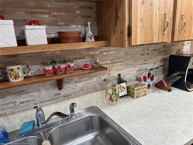 interior details featuring light countertops and a sink