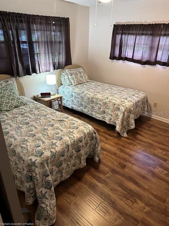 bedroom featuring wood finished floors