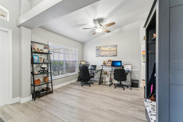 office area with lofted ceiling, baseboards, light wood-style flooring, and a ceiling fan