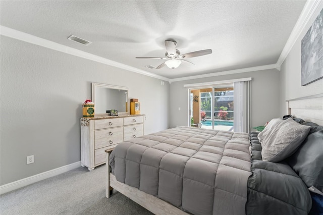 bedroom featuring visible vents, ornamental molding, light carpet, a textured ceiling, and access to outside