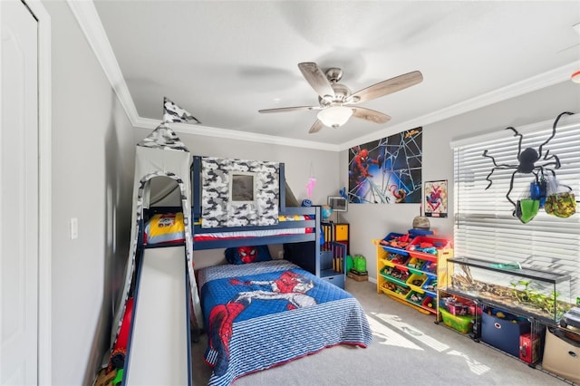 carpeted bedroom featuring ornamental molding and a ceiling fan