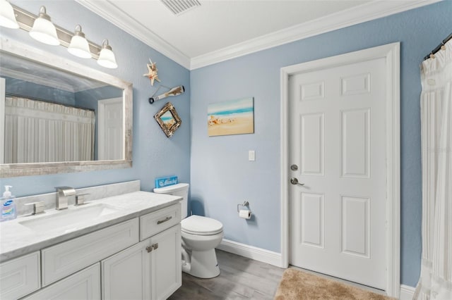 bathroom featuring crown molding, visible vents, toilet, vanity, and wood finished floors