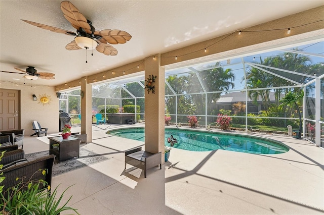 pool with a patio, a lanai, a ceiling fan, and a grill