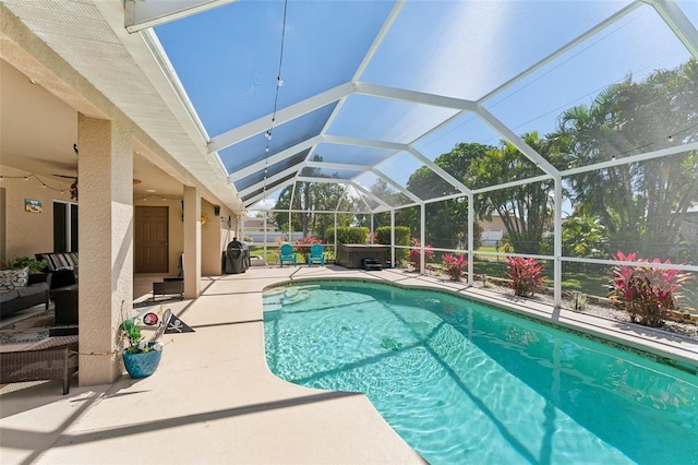 view of pool with a lanai, ceiling fan, a fenced in pool, and a patio