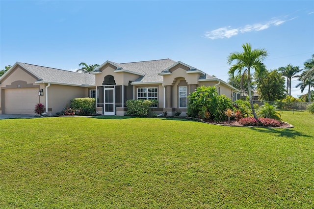 ranch-style home with driveway, a front lawn, an attached garage, and stucco siding