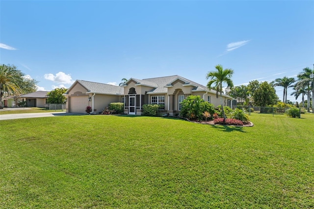 single story home with a garage, a front yard, fence, and driveway