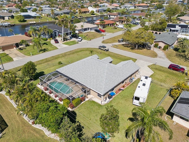 aerial view with a residential view and a water view