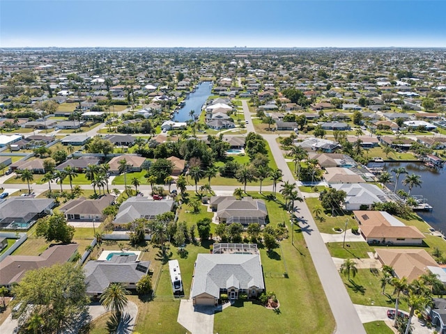 aerial view with a water view and a residential view