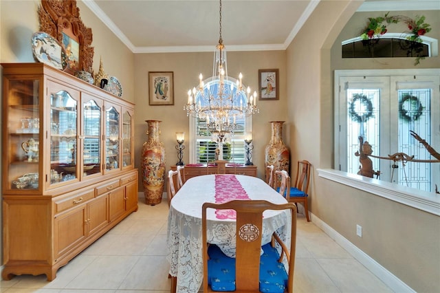 dining space featuring ornamental molding, arched walkways, a chandelier, and light tile patterned flooring