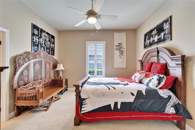 carpeted bedroom with a ceiling fan