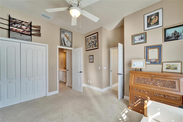 bedroom with a closet, visible vents, a ceiling fan, light carpet, and baseboards