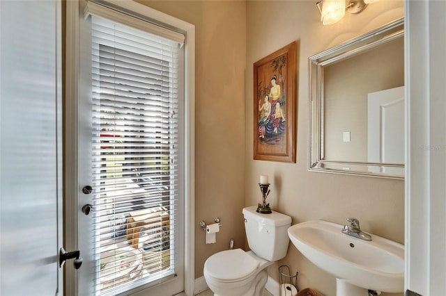 bathroom with a sink and toilet