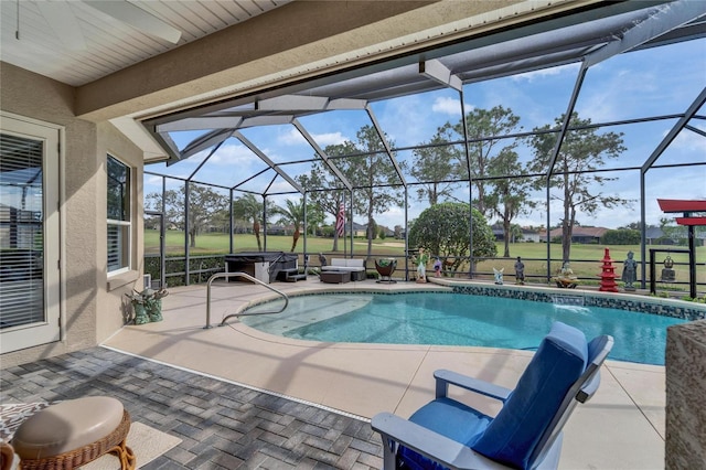 pool featuring a patio area and glass enclosure