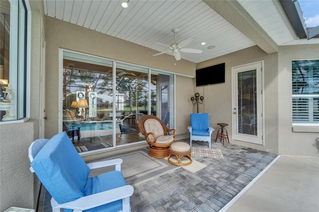 view of patio featuring ceiling fan