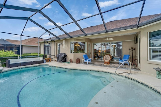 outdoor pool featuring glass enclosure, an outdoor hangout area, area for grilling, and a patio