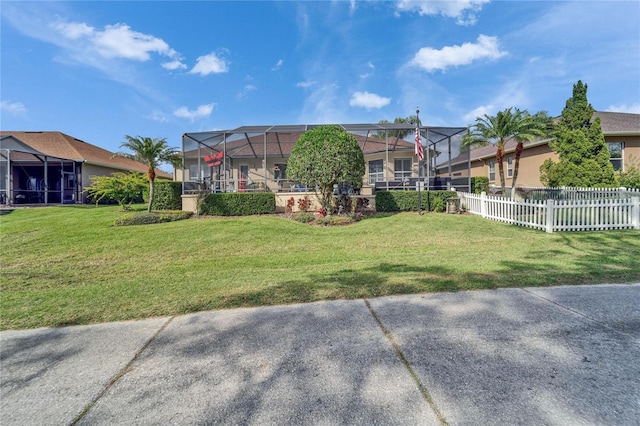 exterior space with a yard, fence, and a residential view