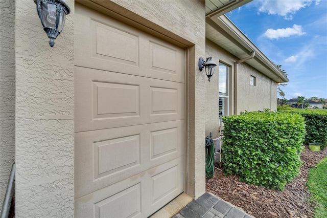 view of exterior entry with stucco siding