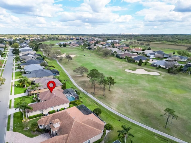 bird's eye view featuring view of golf course and a residential view