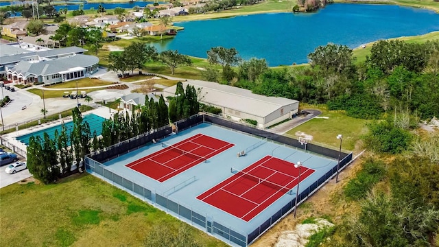 birds eye view of property with a water view