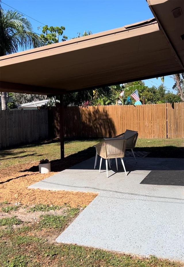 view of patio / terrace featuring fence