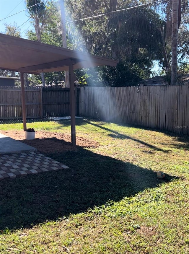 view of yard with a fenced backyard