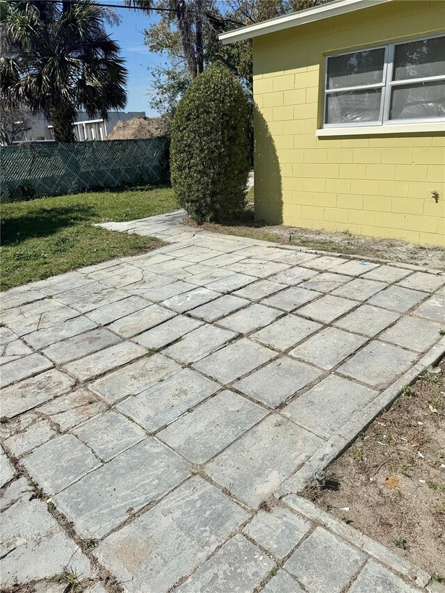 view of patio / terrace featuring fence