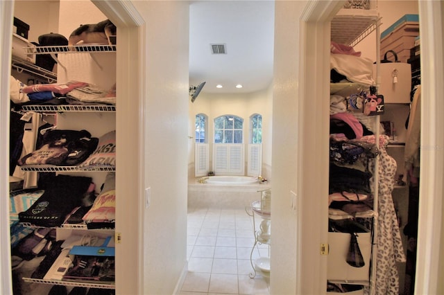 walk in closet with visible vents and tile patterned floors