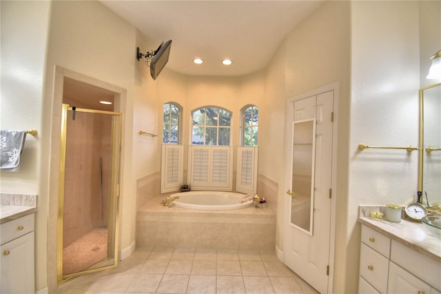 full bathroom featuring a garden tub, recessed lighting, vanity, a shower stall, and tile patterned floors