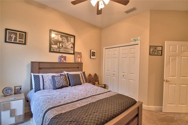 carpeted bedroom with baseboards, a closet, visible vents, and a ceiling fan