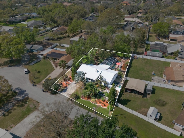 birds eye view of property with a residential view