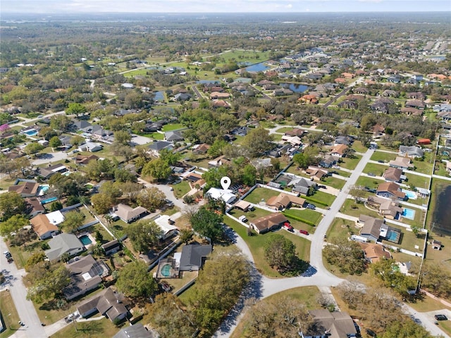 birds eye view of property featuring a residential view and a water view