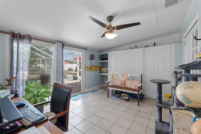 home office with light tile patterned floors, lofted ceiling, visible vents, a ceiling fan, and a sunroom