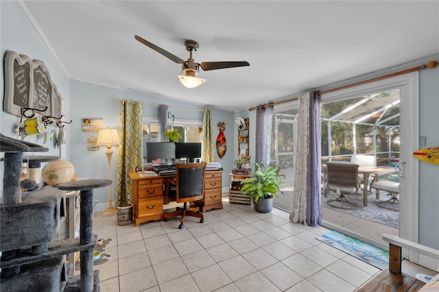 office area with a sunroom, a healthy amount of sunlight, and light tile patterned floors