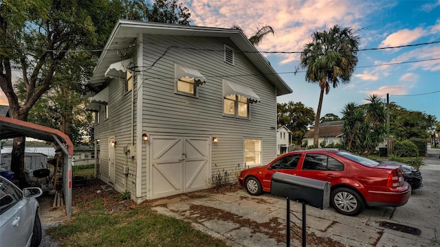 view of property exterior featuring a carport