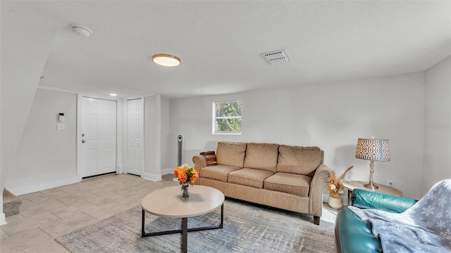 living room with visible vents and baseboards