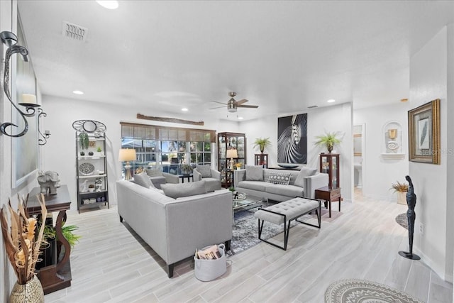 living room featuring ceiling fan, wood finish floors, visible vents, and recessed lighting