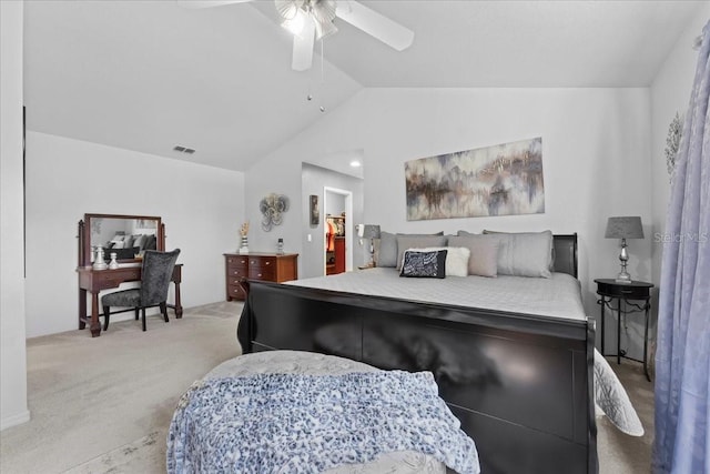 bedroom with a ceiling fan, light colored carpet, and vaulted ceiling