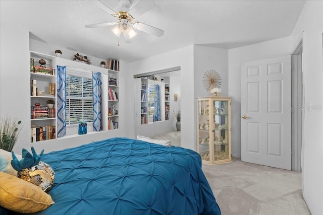 bedroom with a ceiling fan and carpet flooring