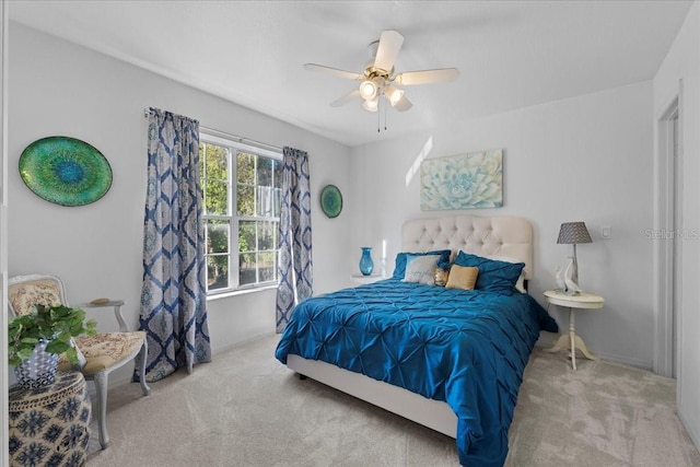 carpeted bedroom with a ceiling fan