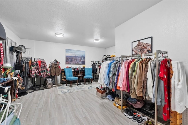 spacious closet with wood finished floors