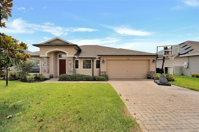 view of front of property with a garage, stone siding, stucco siding, decorative driveway, and a front yard