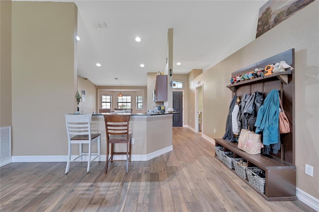 kitchen featuring baseboards, recessed lighting, visible vents, and light wood-style floors