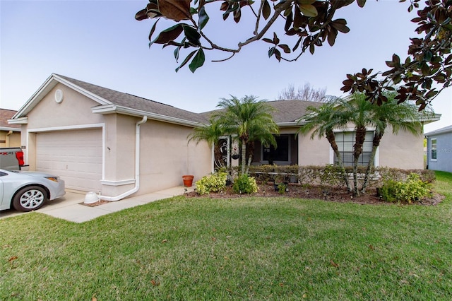 ranch-style house featuring stucco siding, a garage, and a front yard