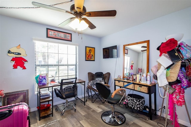 home office with baseboards, ceiling fan, and wood finished floors