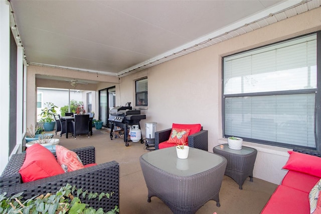 view of patio with area for grilling and outdoor dining area