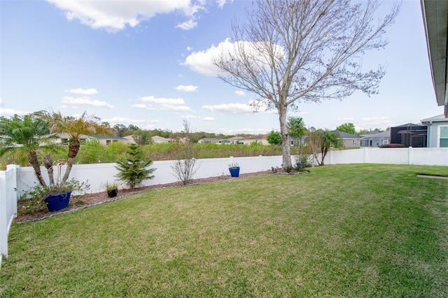 view of yard with a fenced backyard