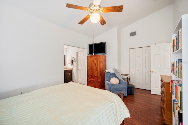 bedroom featuring visible vents, ceiling fan, dark wood-style flooring, high vaulted ceiling, and a closet