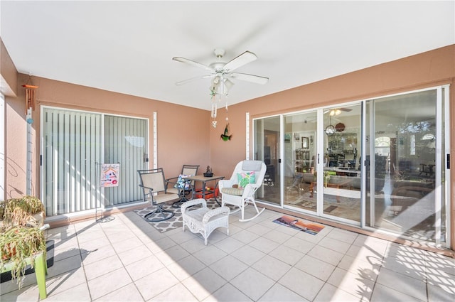 sunroom with plenty of natural light and ceiling fan