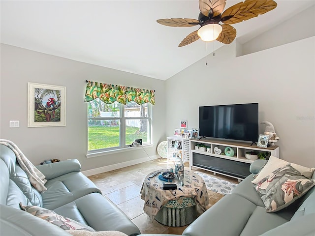 living area featuring baseboards, vaulted ceiling, and a ceiling fan