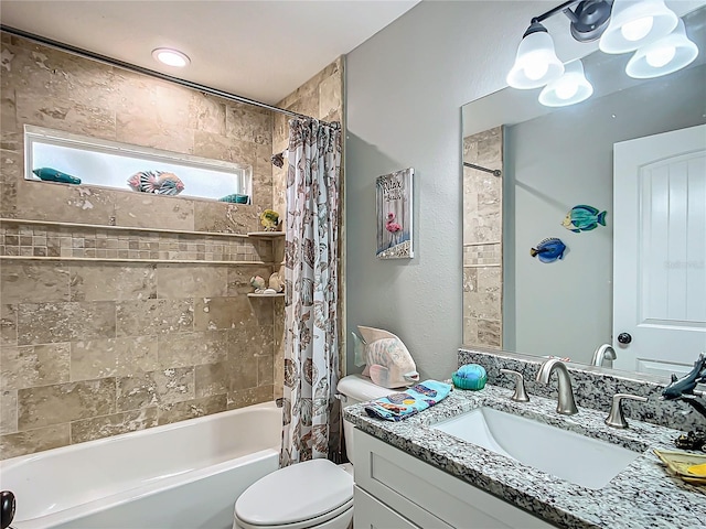 full bathroom featuring toilet, shower / bath combination with curtain, and vanity